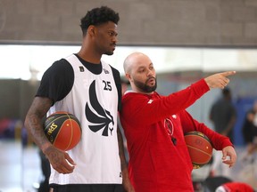 Calgary Surge basketball coach Tyrell Vernon with players in Calgary on Tuesday, May 14, 2024. The team plays its first home game on May 21. Jim Wells/Postmedia