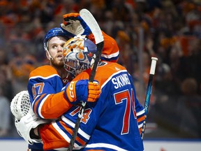 Connor McDavid (97) and goaltender Stuart Skinner (74) of the Edmonton Oilers celebrate a 4-3 victory against of the Los Angeles Kings in Game 5 of their first round Stanley Cup playoff series at Rogers Place on May 1, 2024, in Edmonton.