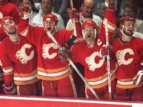 Calgary Flames cheer from the bench on the way to the Stanley Cup in 1989. Great draft picks like Joe Nieuwendyk (second from left) and Gary Roberts (right) helped make it happen.