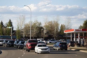 eople line up for gas in Fort McMurray after Fort McMurray and Saprae Creek Estates were told to prepare for a possible evacuation as a wildfire burns 25 kilometres away in May 10, 2024. Vincent McDermott/Fort McMurray Today/Postmedia Network