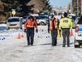 Police investigate the scene in Bowness where a woman was found unconscious after being hit by a vehicle on Monday, Feb. 10, 2020.