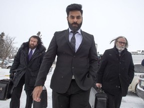 Jaskirat Singh Sidhu, the driver of the truck that collided with the bus carrying the Humboldt Broncos hockey team, arrives with his lawyers Mark Brayford, left, and Glen Luther, right, for closing arguments at his sentencing hearing Thursday, Jan. 31, 2019 in Melfort, Sask.