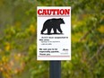 A sign warns off a possible black bear in the area along Glenmore Reservoir near Glenmore Landing on Monday September 10, 2018.