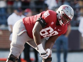 Washington State offensive lineman Christy Nkanu lines up for a play during a game against Northern Colorado on Sept. 16, 2023, in Pullman, Wash.
