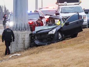 Calgary police investigate a fatal car crash on northbound Deerfoot Trail between Anderson Road and Southland Drive on Wednesday, November 15, 2023.