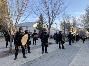 Police in riot gear hold the line after pro-Palestinian protesters were told to leave the University of Calgary campus on Thursday night.