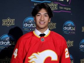 Zayne Parekh poses for a photo after being selected by the Calgary Flames with the ninth overall pick during the NHL Draft at Sphere in Las Vegas on Friday, June 28, 2024.