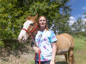 Jessica van der Hoek, president of Prairie Sky Equine Assisted Therapy, with one of her horses
