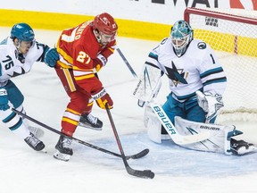 Calgary Flames forward Matt Coronato takes a shot on San Jose Sharks goaltender Devin Cooley at the Scotiabank Saddledome in Calgary on April 18, 2024