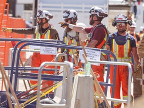 Workers at the water main repair