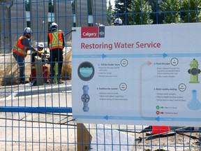 Calgary city workers get ready to flush the pipes at the Shaganappi Pump Station located in the north parking lot of Edworthy Park in Calgary on Friday, June 28, 2024.