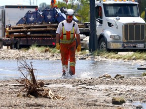 Workers still working on major water main break in Bowness in Calgary on Thursday, June 6, 2024. Darren Makowichuk/Postmedia