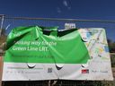 Signage and fencing mark the site of the planned Ogden station for Calgary's CTrain Green Line on Wednesday July 31, 2024.