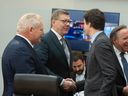 Prime Minister Justin Trudeau greets Saskatchewan Premier Scott Moe and Ontario Premier Doug Ford at the Diefenbaker building in Ottawa ahead of the first minister's meeting on Wednesday, Jan. 15 2025.