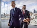 Prime Minister Mark Carney waves to a photographer followed by his Quebec lieutenant Steven Guilbeault following an announcement in Montreal in this photo from April 4.