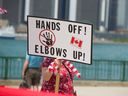 A participant displays a sign at the Elbows Up United Rally held at Dieppe Park in downtown Windsor, Ont., in this photo from July 5.