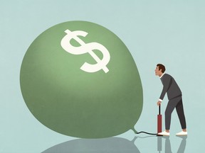 Businessperson inflating dollar sign balloon