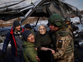 While sanctions on Russian investment are not likely to affect most North American high-net-worth investors, ripple effects may include concerns about investments related to China or emerging markets where the rule of law can be volatile. Here, two men carry a woman as people flee from advancing Russian troops in Irpin, Ukraine, on March 8, 2022.