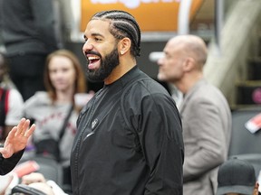 Drake at a Toronto Raptors game on Apr. 7, 2022. The recording artist often gives away money and gifts to individuals.