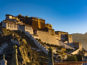 Potala Palace in Tibet at sunrise. One tour by The Luxe Voyager allowed for a private audience and blessing from His Holiness The Head Lama of the Potala Palace in Tibet, which houses rare antique manuscripts and artefacts related to Buddhism.