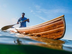 This canoe is made in a woodshop owned and operated by Trent Preszler, who started building them as a way to deal with the death of his father.