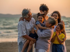 A multigenerational family on the beach. The current environment has family offices turning to more active strategies as uncorrelated returns become harder to find.