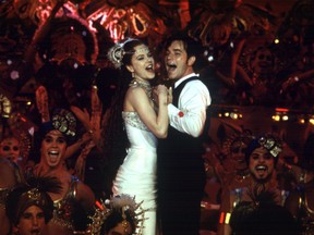 Satine (Nicole Kidman) and Christian (Ewan McGregor) profess their love for each other in one of the many musical numbers featured in the film Moulin Rouge. A unique travel concept: re-enact movies, such as Moulin Rouge, set in Paris.