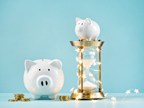 Piggy bank and rustic hourglass wrapped in holiday lights. Whether moved to donate by the holiday spirit or through a long-term philanthropic plan, giving can build a multigenerational legacy.