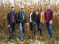 Standing in a corn field, the Townsend family is the next generation of one of the company’s founders. From left, Mitchell, Blair, Livia, Courtney and Tanner Townsend, and their dog, Lincoln.