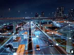 A photo illustration of a highway at night with a downtown highrise backdrop and intersecting data points. From physical to digital infrastructure, in a world that constantly needs repair, upgrading and innovative new energy and data systems, private equity investment is increasingly important.