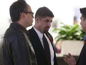 Political strategist Nick Kouvalis (centre) was in the rotunda of Toronto City Hall with councillor Denzil Minnan-Wong just before mayor-elect John Tory addressed media on his reaction to an idea to improve the TTC form the transit workers union on Monday November 10, 2014.