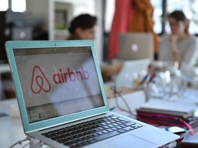 This file photo taken on April 21, 2015 shows the logo of online lodging service Airbnb displayed on a computer screen in the Airbnb offices in Paris on April 21, 2015.