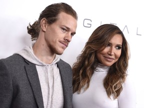 In this Dec. 4, 2015, file photo, Ryan Dorsey, left, and Naya Rivera arrive at an event at the Beverly Wilshire hotel in Beverly Hills, Calif. Rivera, an actress on the former hit show "Glee" was charged with domestic battery on her husband, Dorsey in Chesapeake, W.V., the Kanawha County Sheriff's Office tweeted Sunday, Nov. 26, 2017.