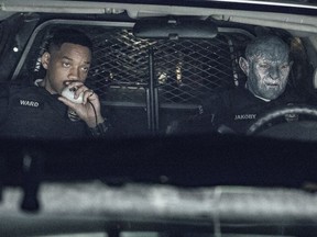 This image released by Netflix shows Will Smith, left, and Joel Edgerton in a scene from, "Bright." (Matt Kennedy/Netflix via AP)