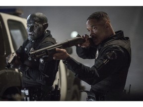 This image released by Netflix shows Will Smith, right, and Joel Edgerton in a scene from, "Bright." (Matt Kennedy/Netflix via AP)