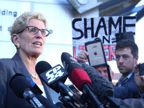 Premier Kathleen Wynne speaks to media at a courthouse in Sudbury, Ont. on Wednesday September 13, 2017.