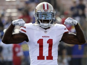 San Francisco 49ers wide receiver Marquise Goodwin gestures as he comes onto the field before an NFL football game against the Los Angeles Rams, Sunday, Dec. 31, 2017, in Los Angeles.