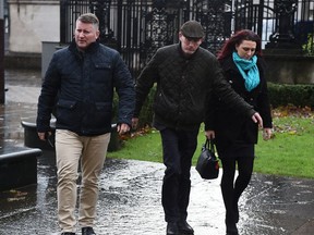 Britain First deputy leader Jayda Fransen (R) arrives at Belfast Laganside Courts along with Britain First leader Paul Golding (L) on December 14, 2017 in Belfast, Northern Ireland.
