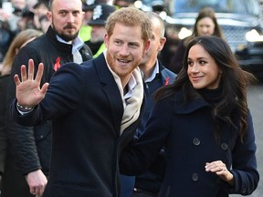 Britain's Prince Harry and his fiancee US actress Meghan Markle greet wellwishers on a walkabout as they arrive for an engagement at Nottingham Contemporary in Nottingham, central England, on December 1, 2017.
