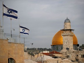 Israeli flags fly near the Dome of the Rock in the Al-Aqsa mosque compound on December 5, 2017.