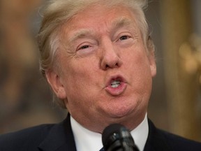 US President Donald Trump speaks during a signing ceremony for Space Policy Directive 1, with the aim of returning Americans to the Moon, in the Roosevelt Room at the White House in Washington, DC, December 11, 2017.