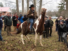 Republican Senatorial candidate Roy Moore departs on his horse at the polling station after voting in Gallant, AL, on December 12, 2017.