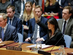 US Ambassador to the UN Nikki Haley raises her hand as opposed to the vote on a draft resolution that would reject US President Donald Trump's decision to recognize Jerusalem as the capital of Israel during a meeting on the situation in the Middle East including Palestine on December 18, 2017, at UN Headquarters in New York.