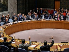 Members of the UN Security Council vote 15-0 to impose new sanctions on North Korea during a Security Council meeting over North Korea on December 22, 2017, at UN Headquarters in New York City.