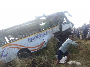 An Indian bus is pulled from the Banas River after a deadly accident in Sawai Madhopur, some 160 kilometres (100 miles) from Jaipur in Rajasthan state, on December 23, 2017. At least 32 people were killed on December 23 when their bus swerved off a bridge and plunged 30 metres (100 feet) onto a riverbed in the western Indian state of Rajasthan, police said.