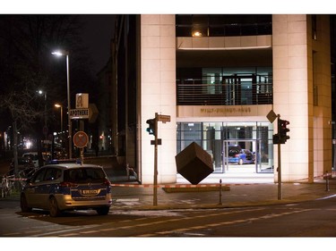 Police officers inspect damage in the lobby of the German Social Democratic Party  headquarters after a car was used to ram the building early Dec. 25, 2017.  (ODD ANDERSEN/AFP/Getty Images)