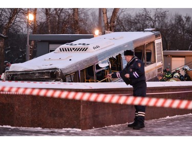 Rescuers pull out a city bus after it plowed into a pedestrian underpass in western Moscow on Dec. 25, 2017. (VASILY MAXIMOV/AFP/Getty Images)