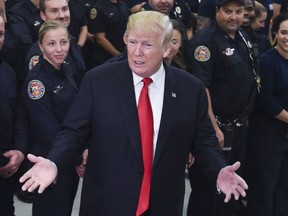U.S. President Donald Trump speaks to first responders at West Palm beach Fire rescue in West Palm Beach, Florida on December 27, 2017.
