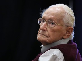 (FILES) This file photo taken on July 1, 2015 shows defendant and German former SS officer Oskar Groening, dubbed the "bookkeeper of Auschwitz", at court in Lueneburg, northern Germany, ahead of his trial. The former Nazi SS guard, now 96, lost his final legal challenge against his jail sentence, as Germany's highest court rejected his appeal on December 29, 2017.