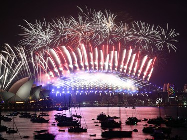 Fireworks light the sky over the Opera House and Harbour Bridge during New Year's Eve celebrations in Sydney early on January 1, 2018. (SAEED KHAN/AFP/Getty Images)